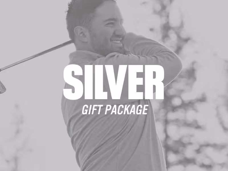 Man smiling while swinging a golf club outdoors with overlaid text 'Silver Gift Package'.