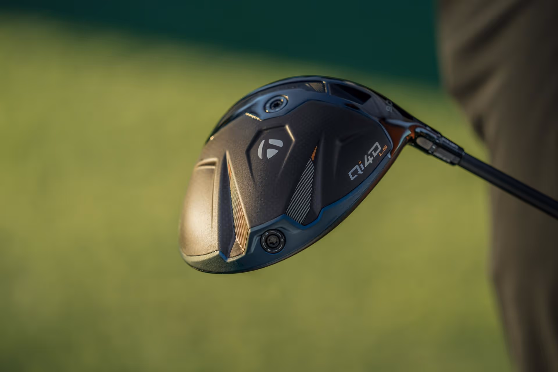 Close-up of a TaylorMade golf driver club head with model R14D