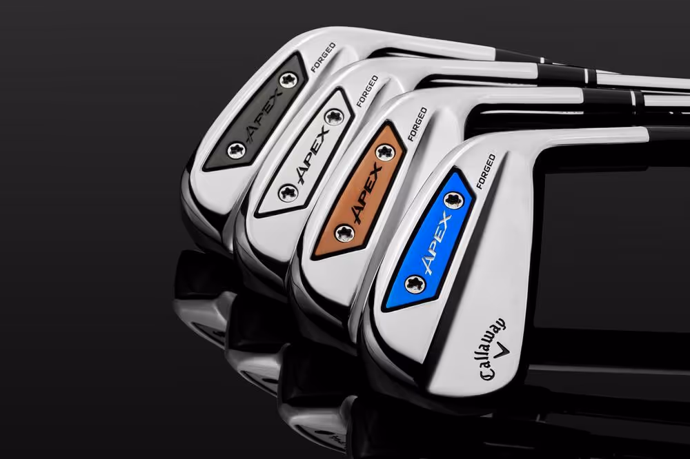 Various color options of Apex 150 iron clubheads viewed from back against dark backgroun