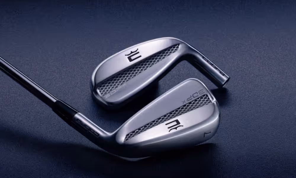 Two Cobra 3DP iron clubheads displayed against a navy background