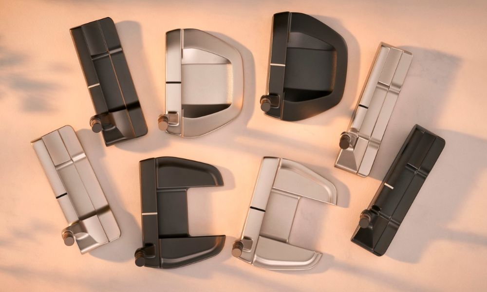 Multiple Mizuno M-Craft putter head shapes displayed from above on a warm-toned background