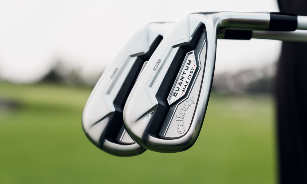 close up view of the quantum max fast iron clubhead view with faded course background