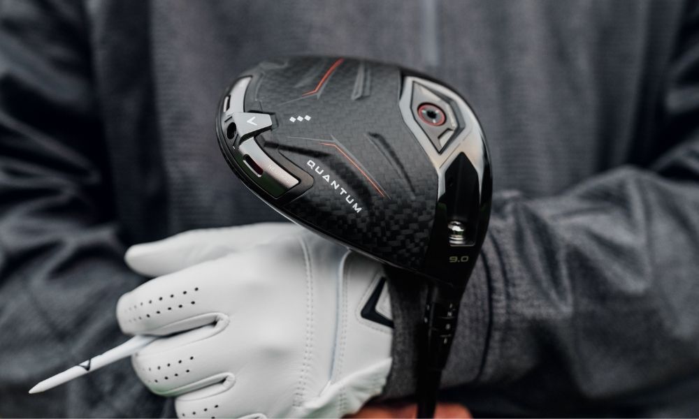 Golfer holding Quatum triple diamond driver in their arm
