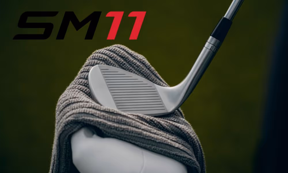 SM11 golf club being cleaned with towel on the course