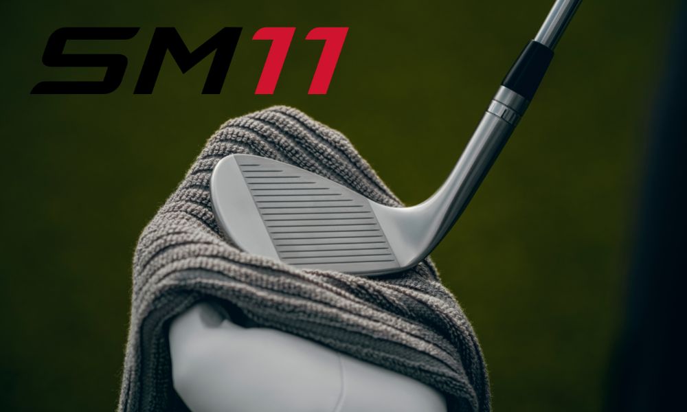 SM11 golf club being cleaned with towel on the course