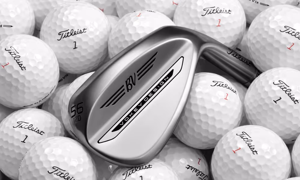 close-up of the vokey wedge against a bunch of titleist 1 golf balls