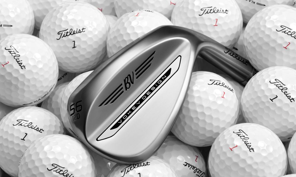 close-up of the vokey wedge against a bunch of titleist 1 golf balls