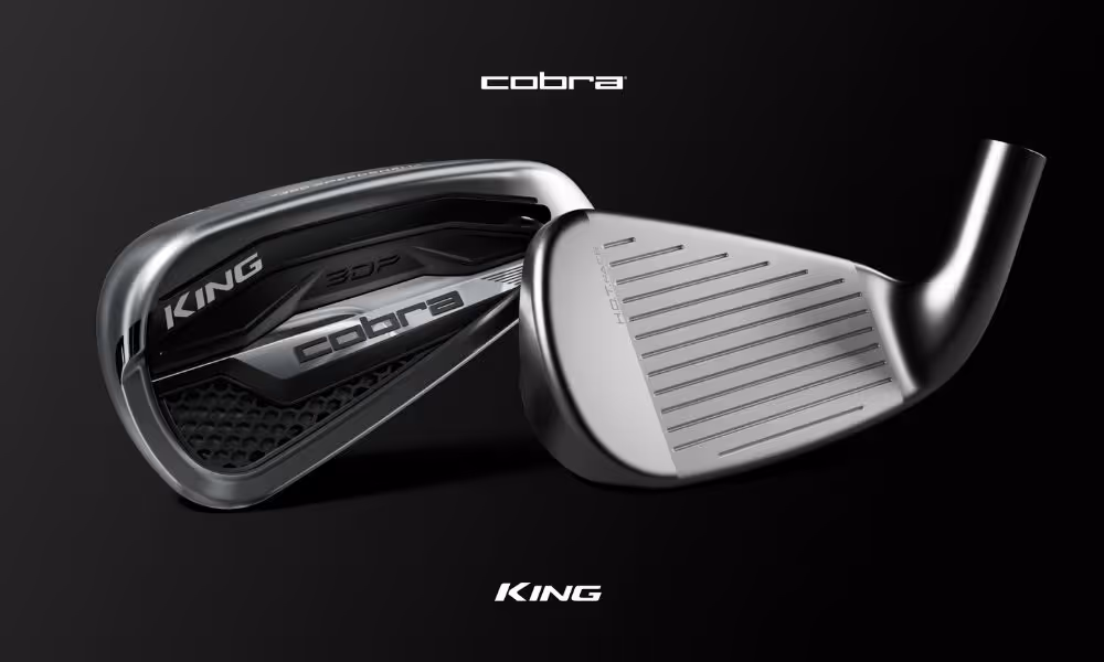 KING COBRA close up of the front and back of the iron head against black background