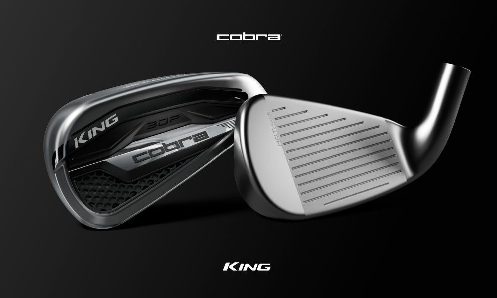 KING COBRA close up of the front and back of the iron head against black background