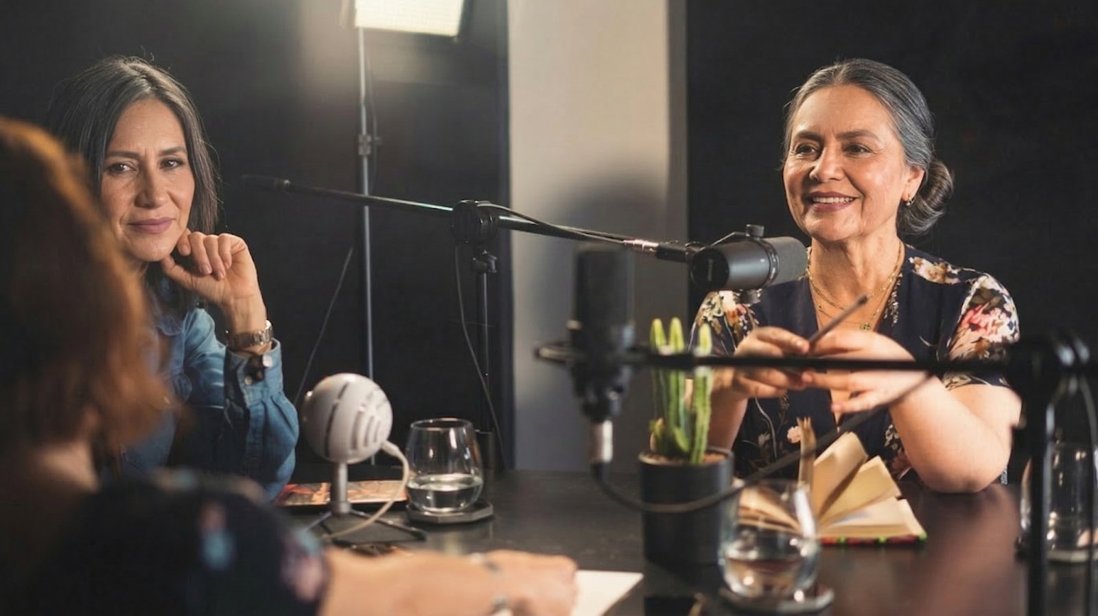  women having conversation inside the recording studio