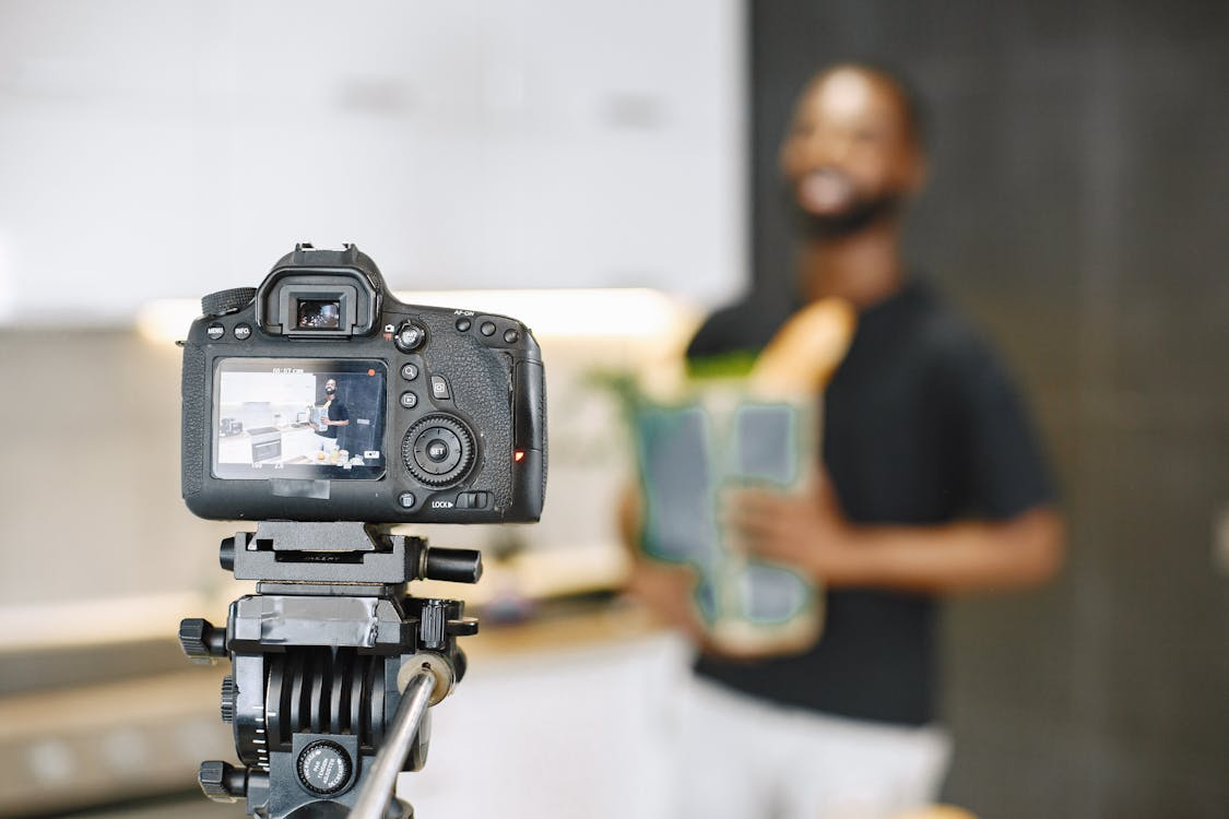 selective focus photo of black dslr camera