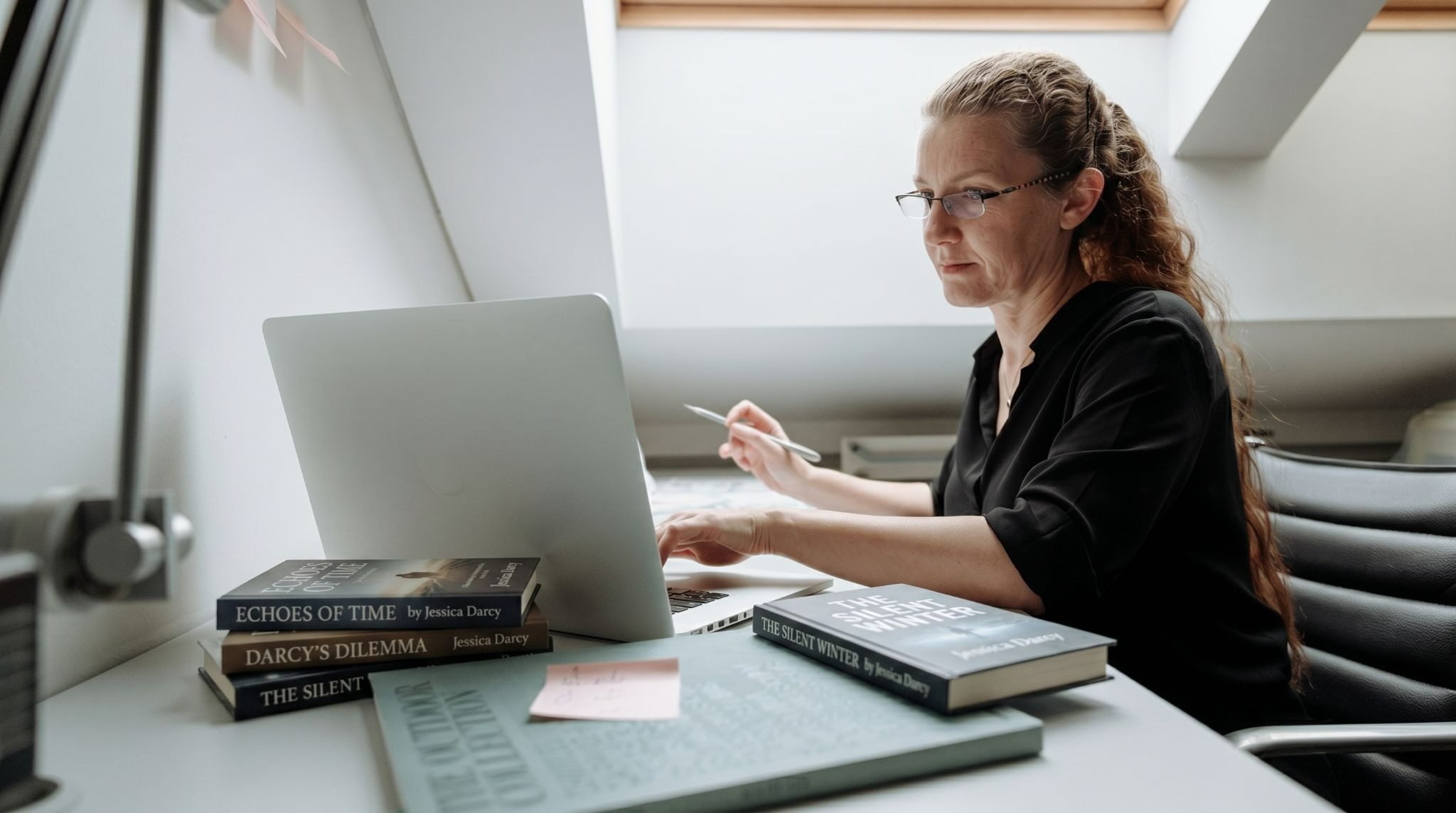 Author building an email list using a laptop