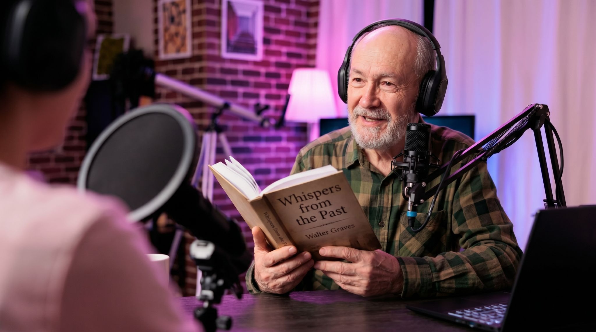 Author speaking into a microphone during a podcast recording session