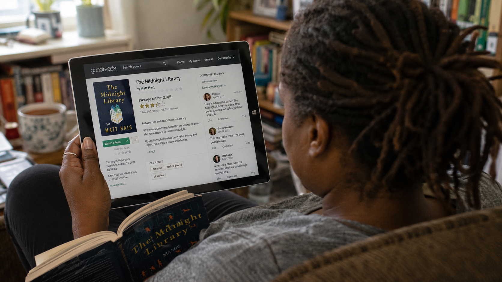 Reader checking Goodreads reviews on a tablet 