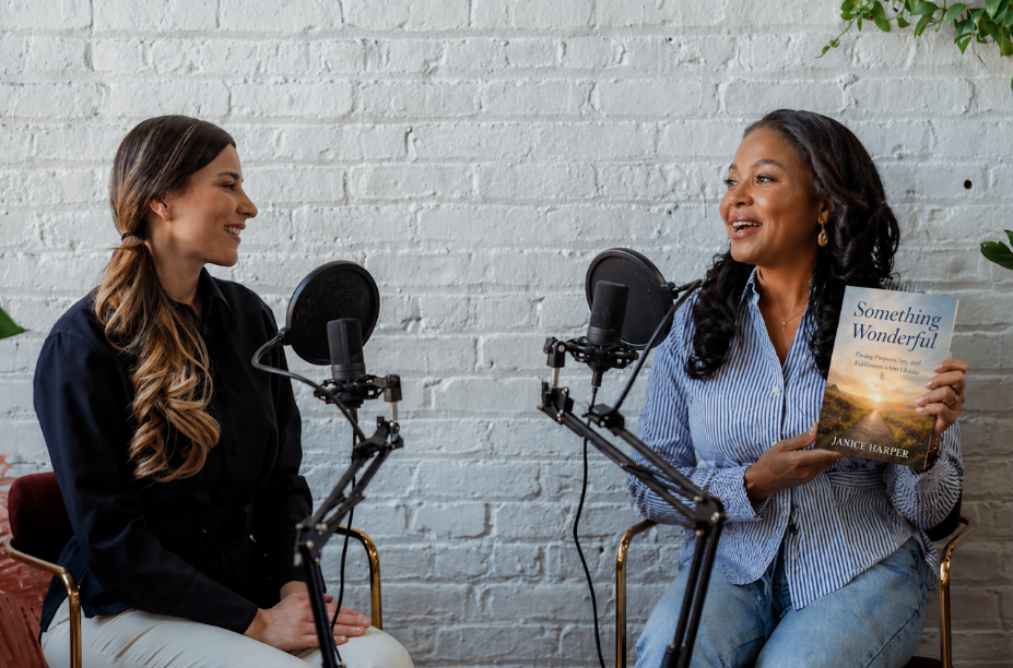 Podcast host and author guest speaking into microphones during a recorded interview