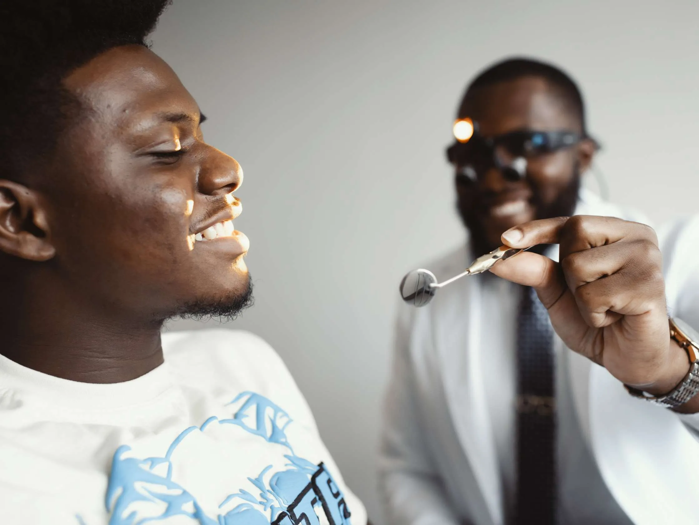 Dr. Ozumba doing work on a younger patient