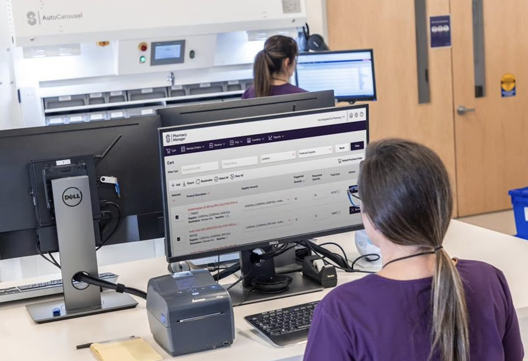 A man working as a tech support employee with woman coworker in the background