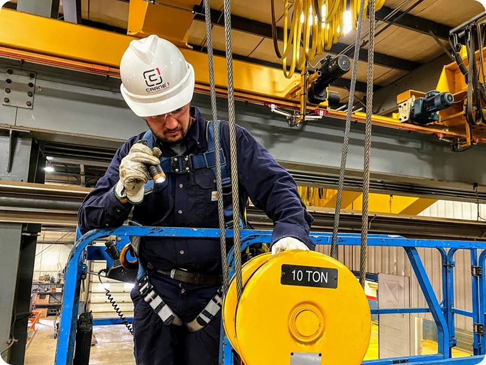A man working as a tech support employee with woman coworker in the background