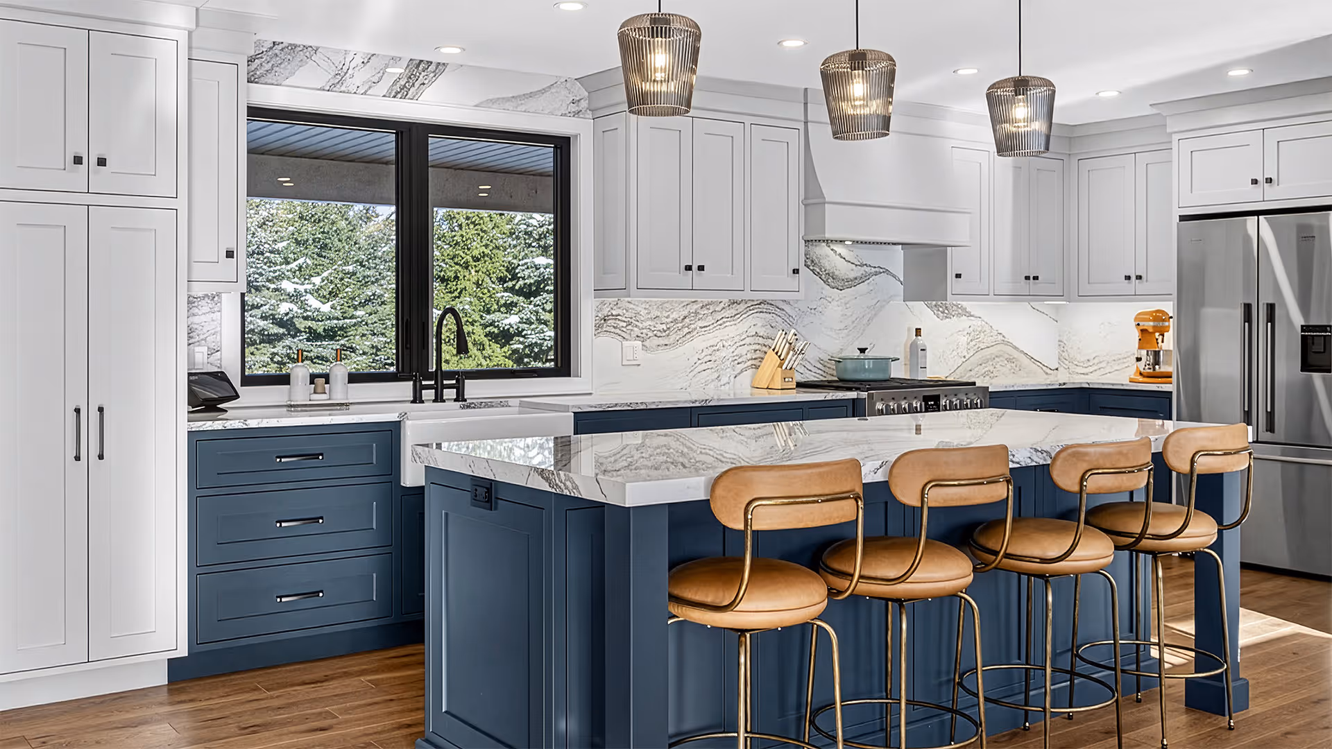 Modern white kitchen with stainless steel refrigerator, built-in microwave and oven, white countertops, and wooden flooring with a light gray rug.