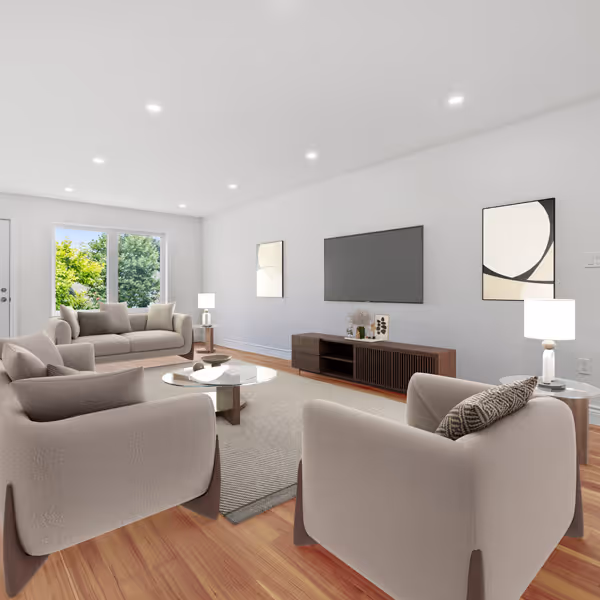 Modern living room corner with a gray sofa adorned with patterned pillows, a wooden shelf with decorative items, and a lit fireplace with a textured gray wall.