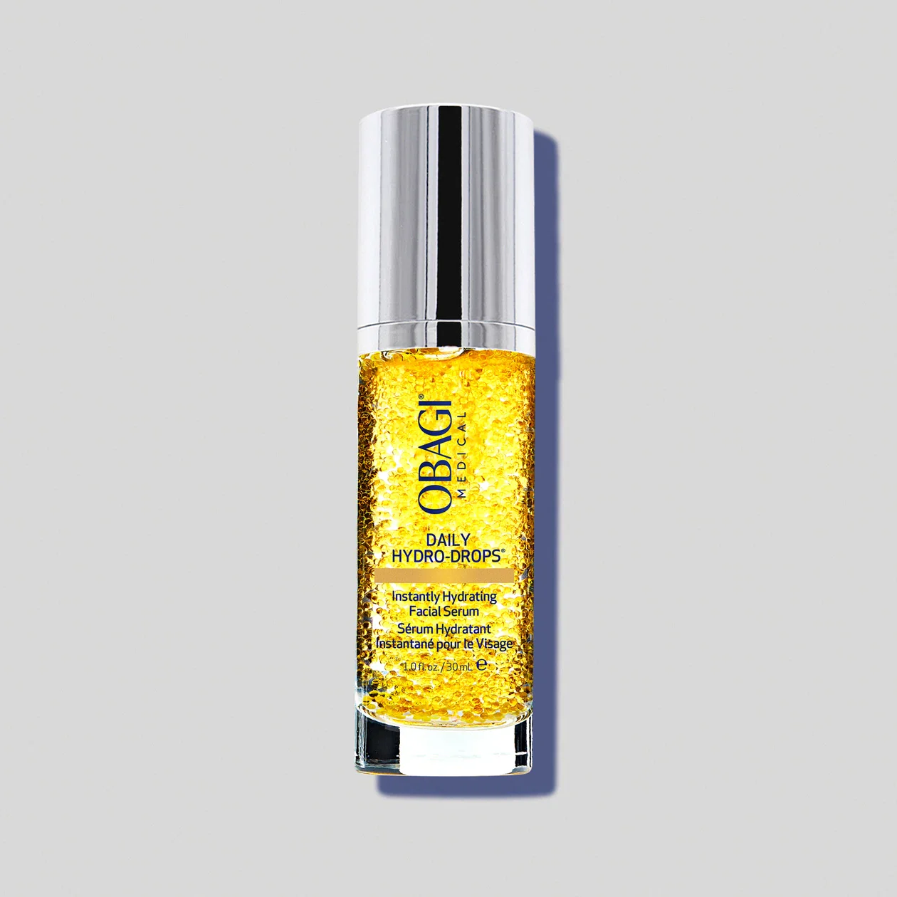 Obagi Medical Daily Hydro-Drops instantly hydrating facial serum in a transparent bottle with yellow gel and bubbles, silver cap.