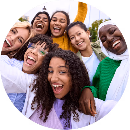 Group of Smiling Friends Taking a Selfie in an Urban Park