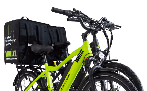 Bright green WHIZZ electric bike equipped with a large black insulated delivery bag on the rear rack.