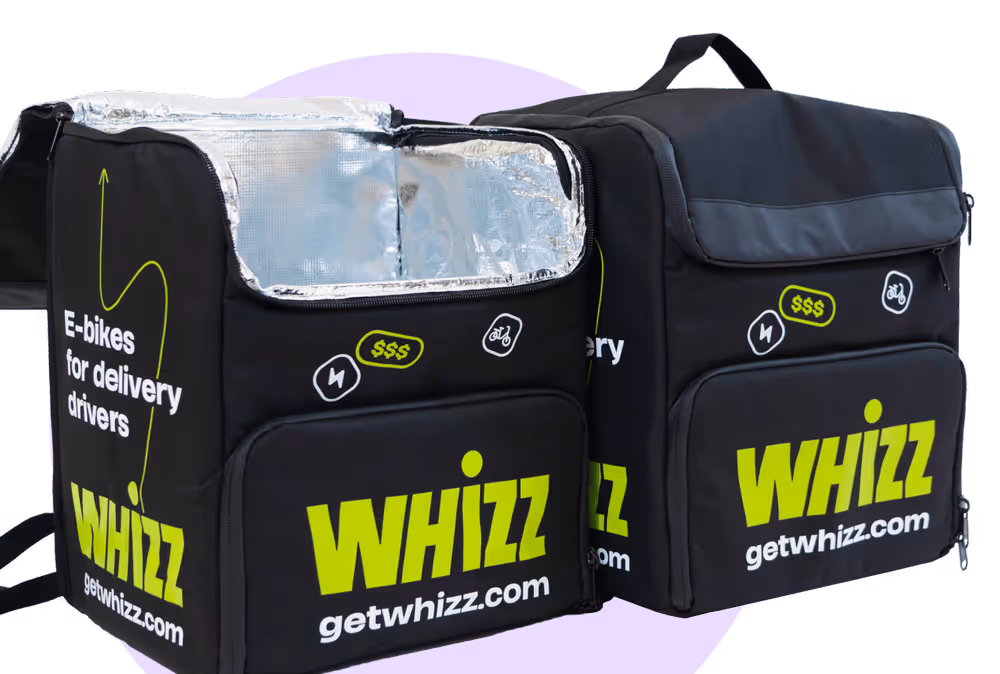 Two black insulated delivery backpacks with bright green Whizz branding and getwhizz.com, designed for e-bikes delivery drivers.