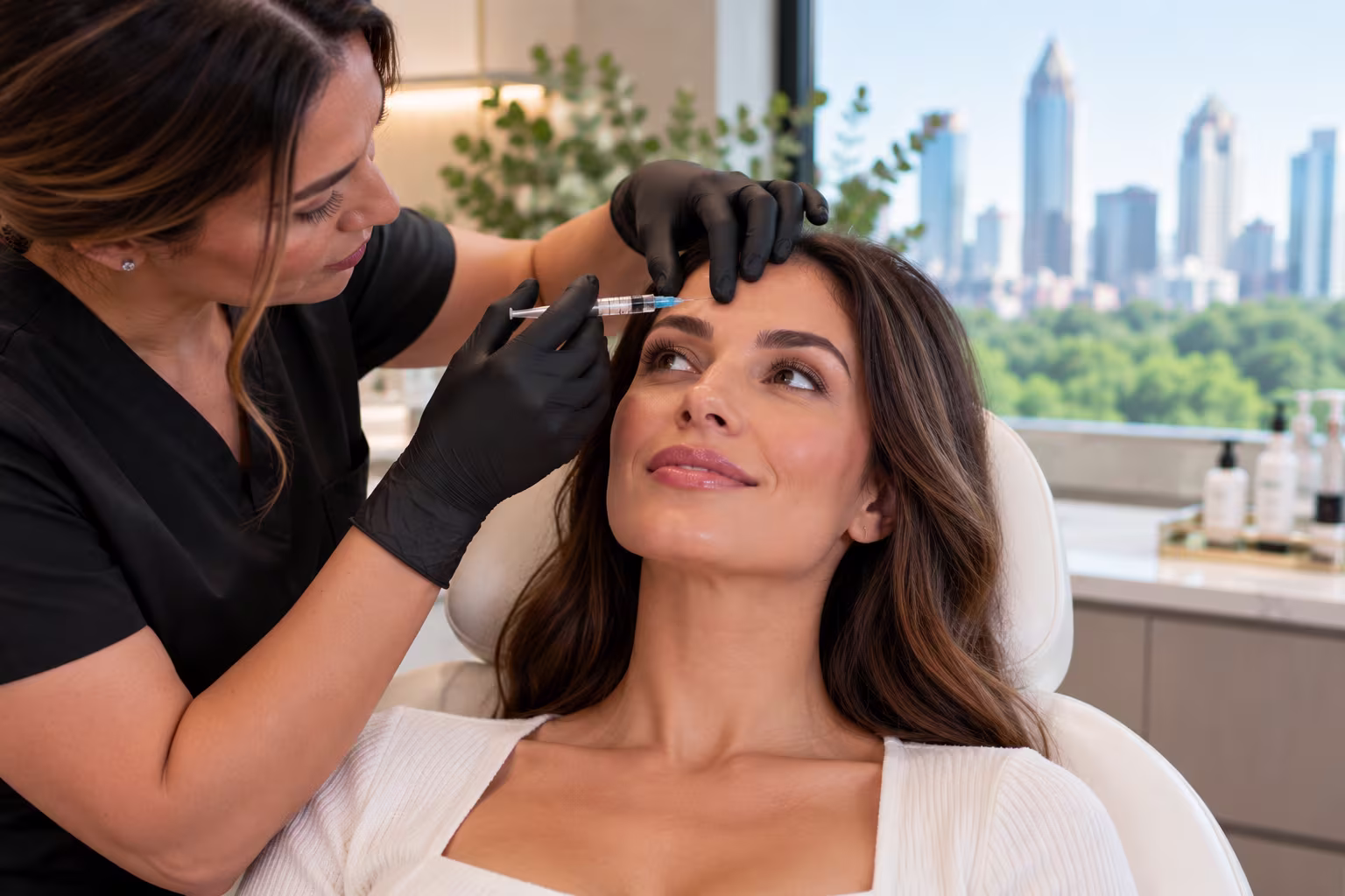 Injector explaining Botox treatment to client at medspa in Buckhead Georgia