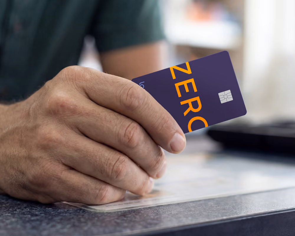 Here are a few options: Descriptive and product-focused: "A person holding a Lopay Card, used to spend and access funds instantly with 0% processing fees.