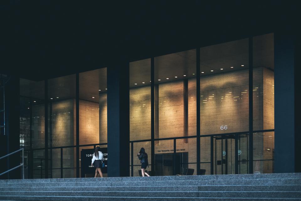 Office building with large windows and a brightly lit interior