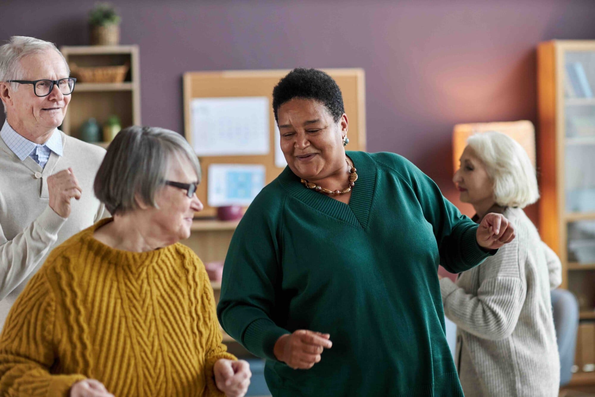 A carer enjoying an activity session with residents