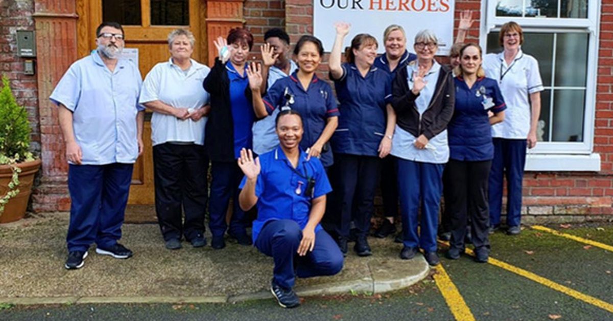 The Cornerstone Healthcare team waving outside one of their services