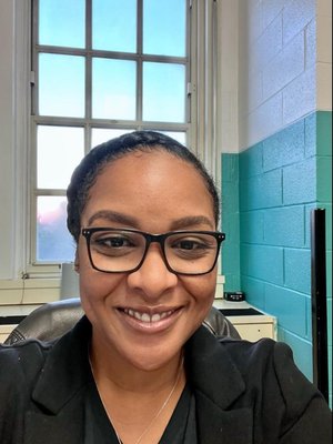 Mrs. Trapp smiling in school office setting