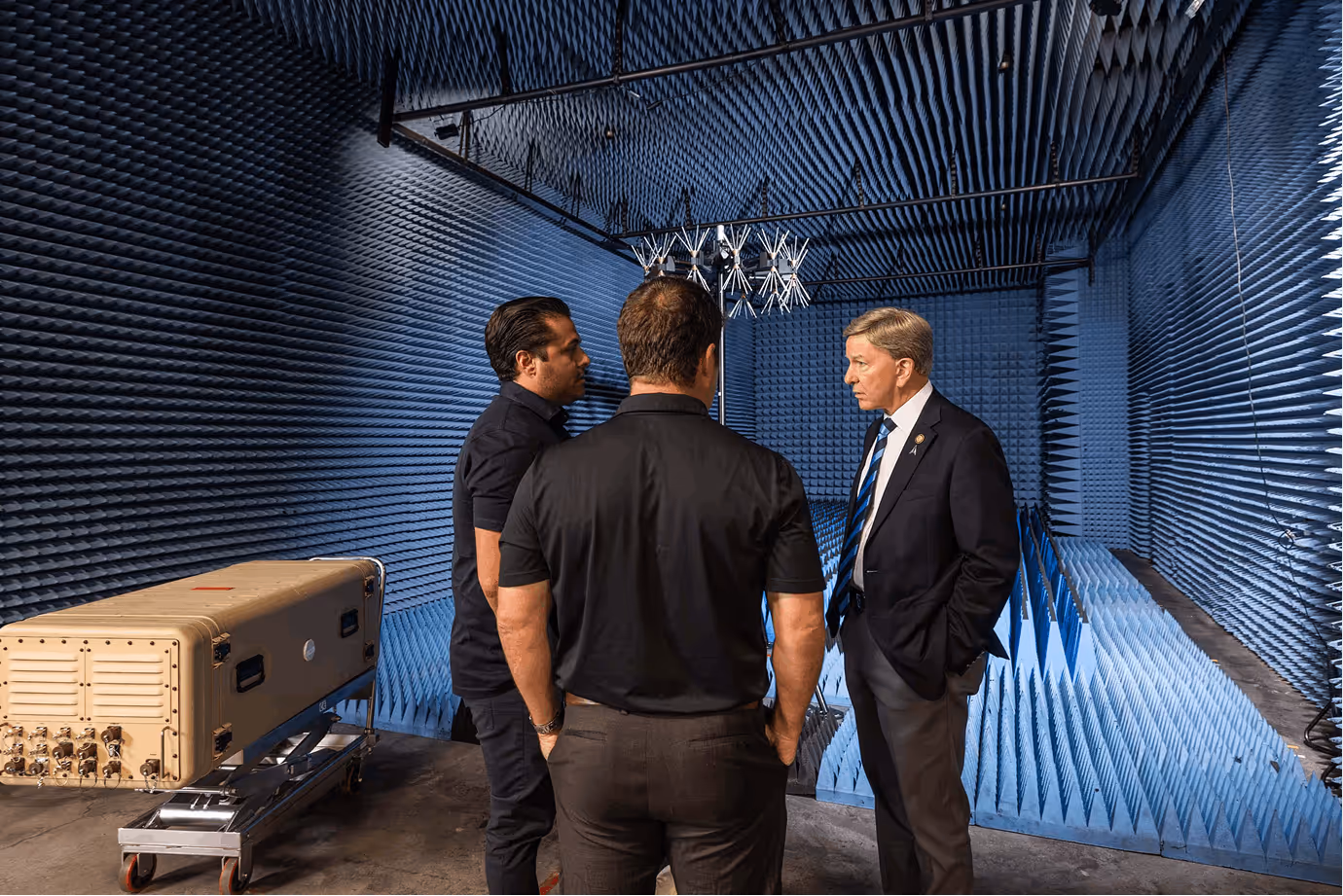 Executives meet inside electromagnetic testing chamber