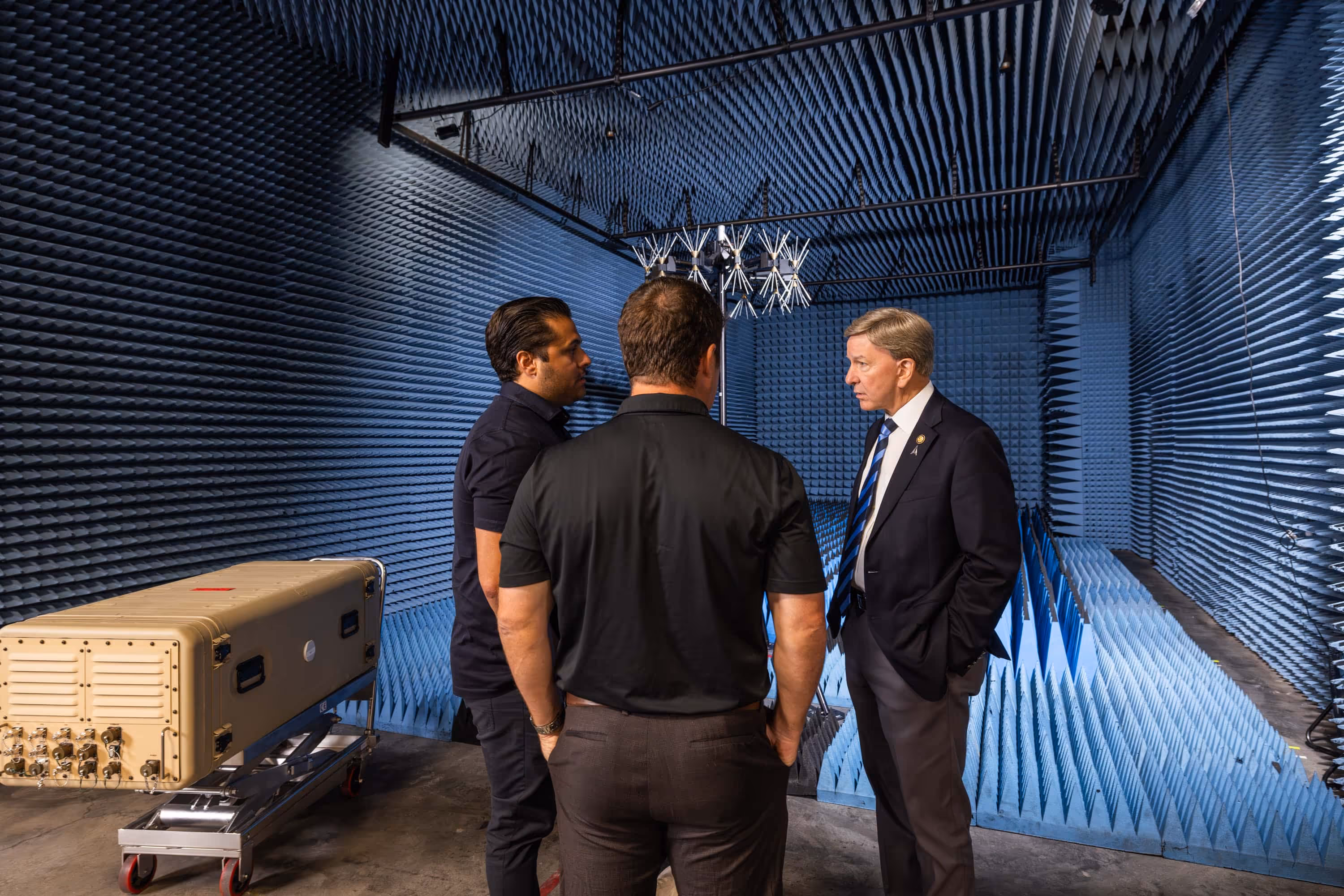 Executives meet inside electromagnetic testing chamber