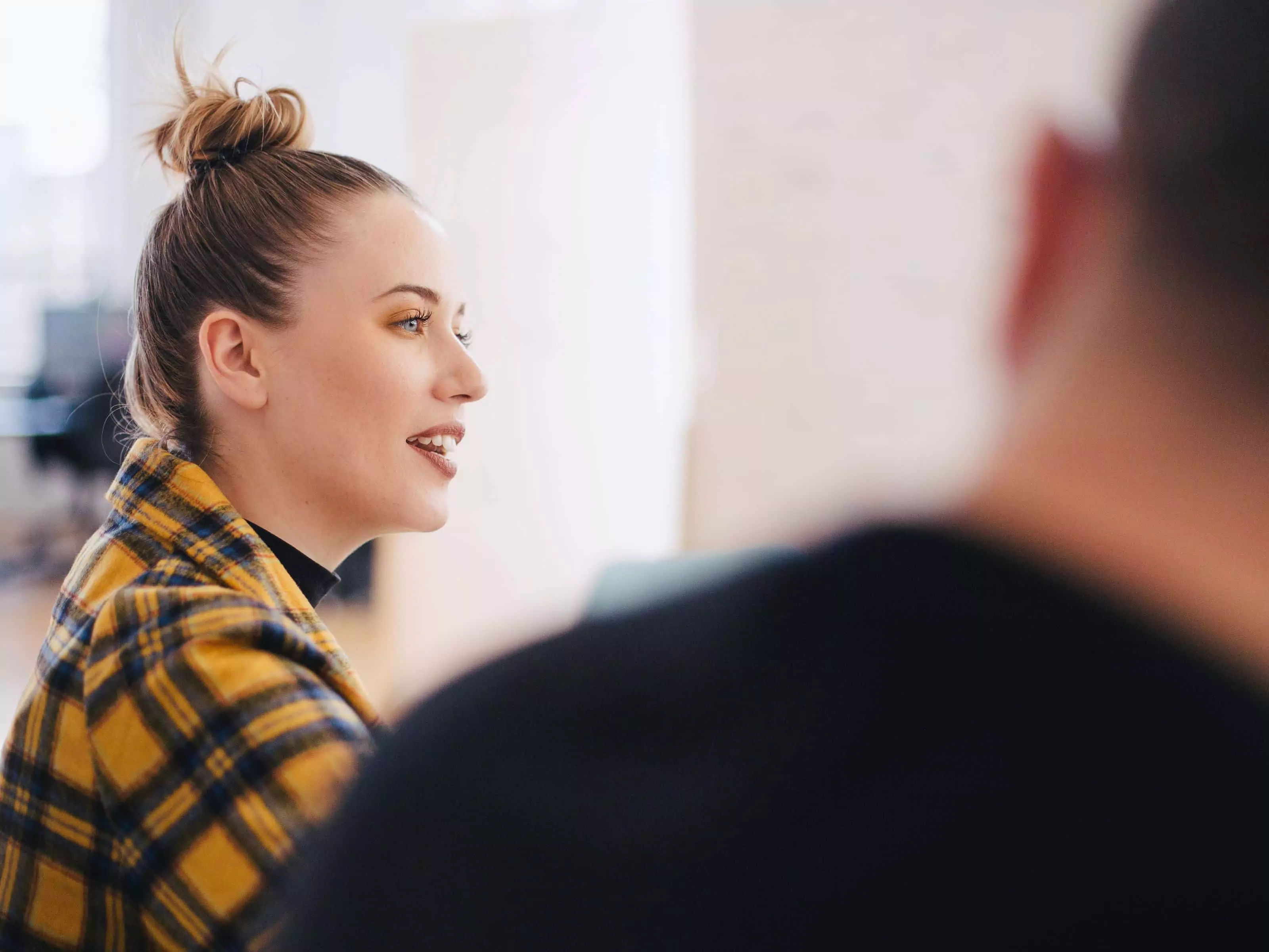 Woman talking at team meeting