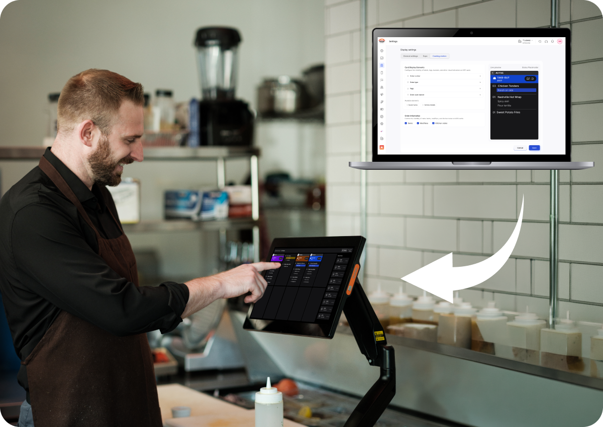 A man wearing a black shirt and brown apron operates a touchscreen point-of-sale system in a kitchen, with a white arrow pointing to a laptop screen showing order settings and a live order preview.