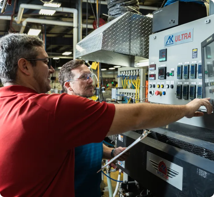 ryan and cory working through some engineering at lincoln plastics
