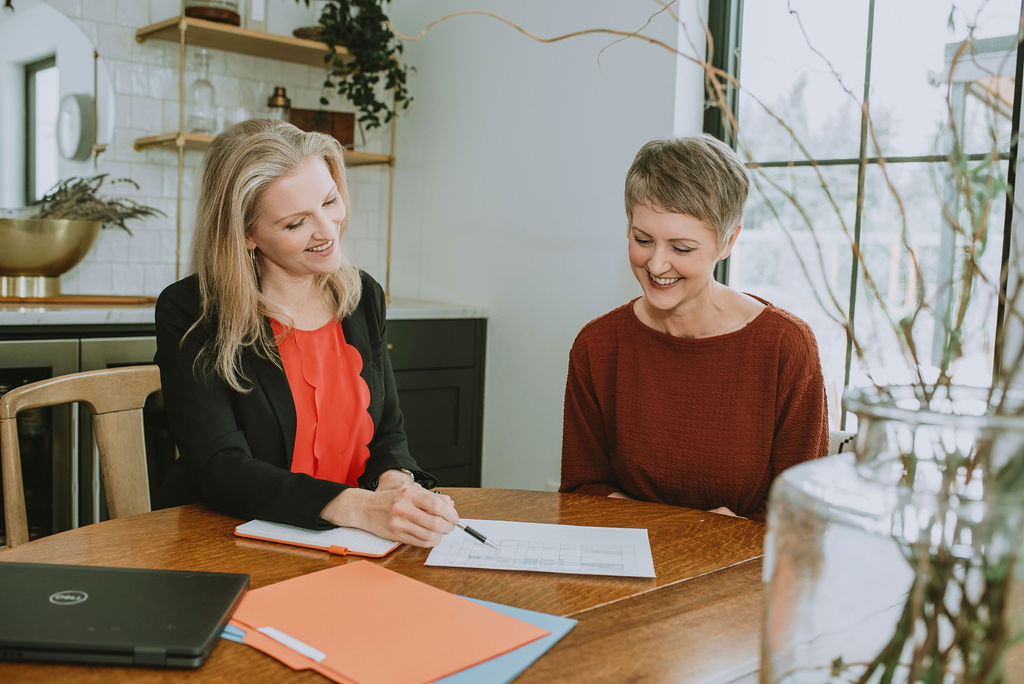 The owner, Katie, Helping a business owner get caught up, prepares for tax filing, reviews their books, and cuts to expenses.