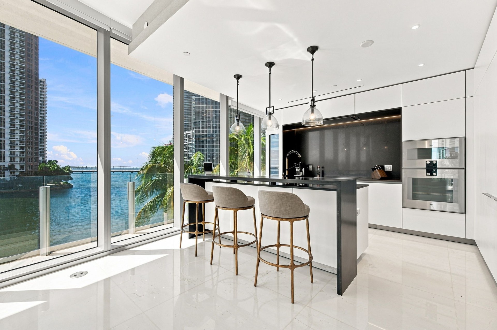 Bedroom with private balcony and bay views — Residence 301