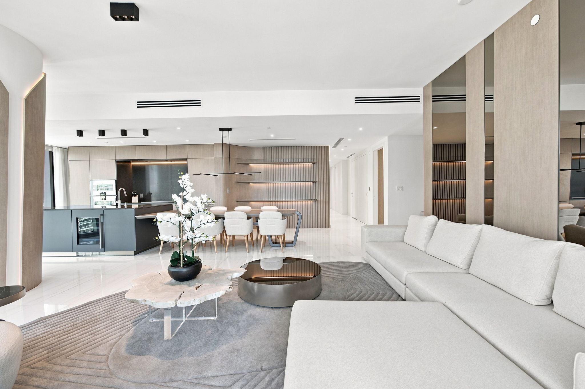 Open living, dining and kitchen looking toward the entry — Residence 3807