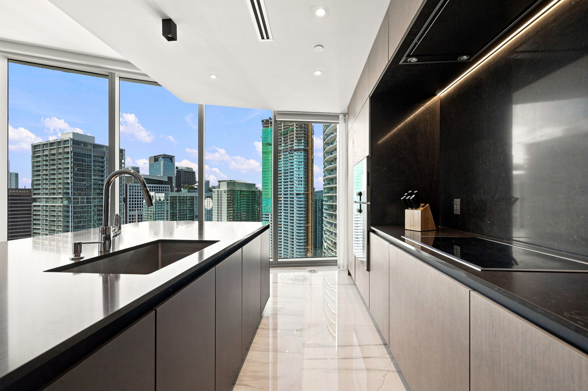 Kitchen prep counter with Miami skyline views — Residence 3807