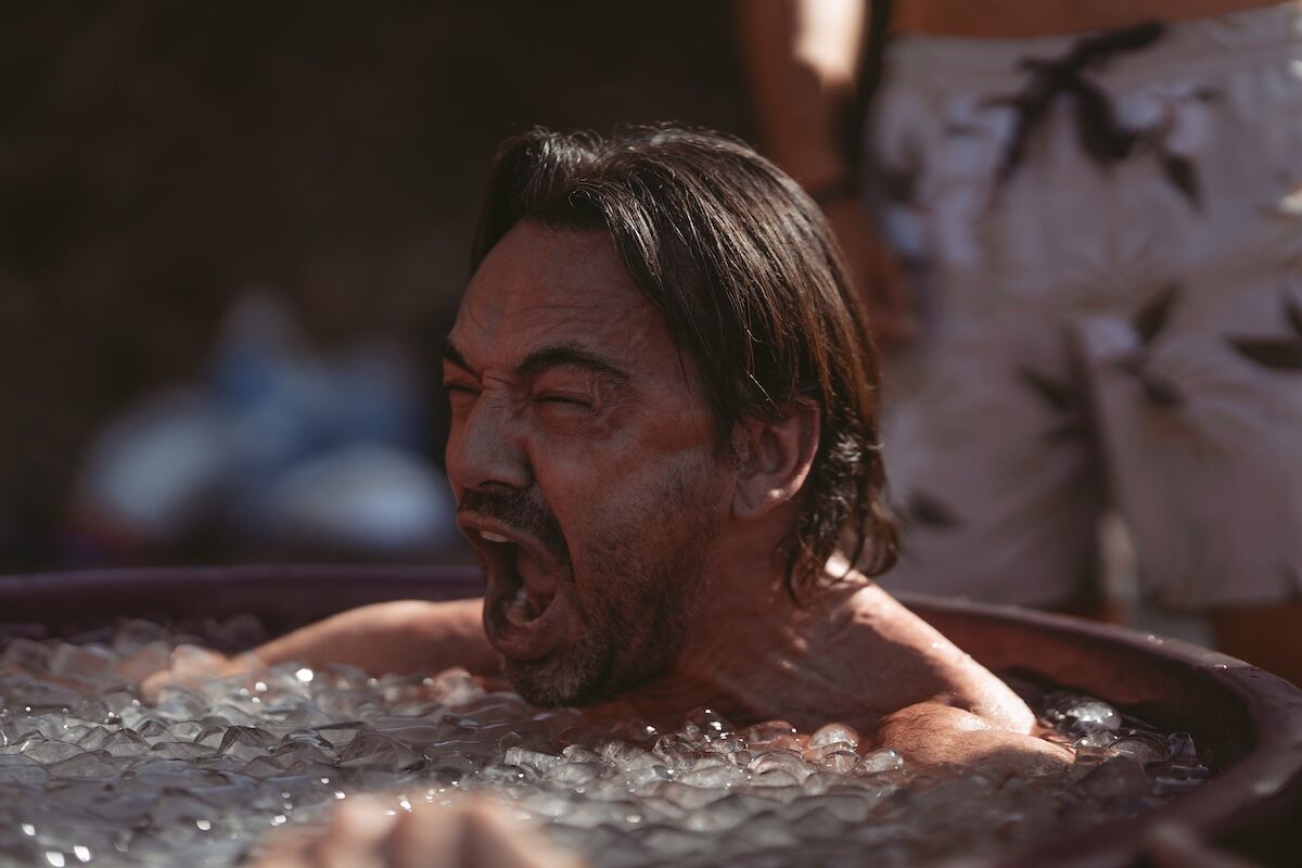 A man exhales through the cold of the ice bath at The Return of Men retreat, Portugal, October 2025.