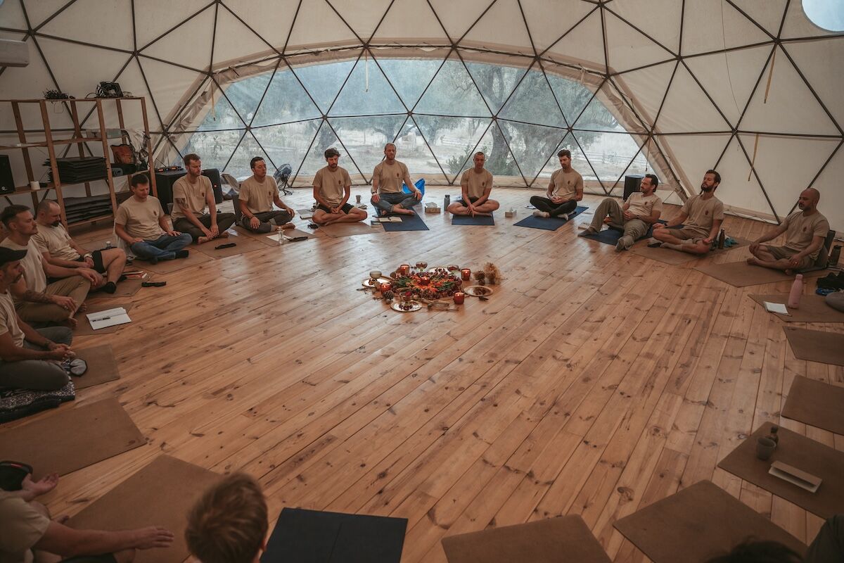 The men sit in circle inside the geodesic dome around the central altar at The Return of Men retreat, BioVilla, Arrábida.