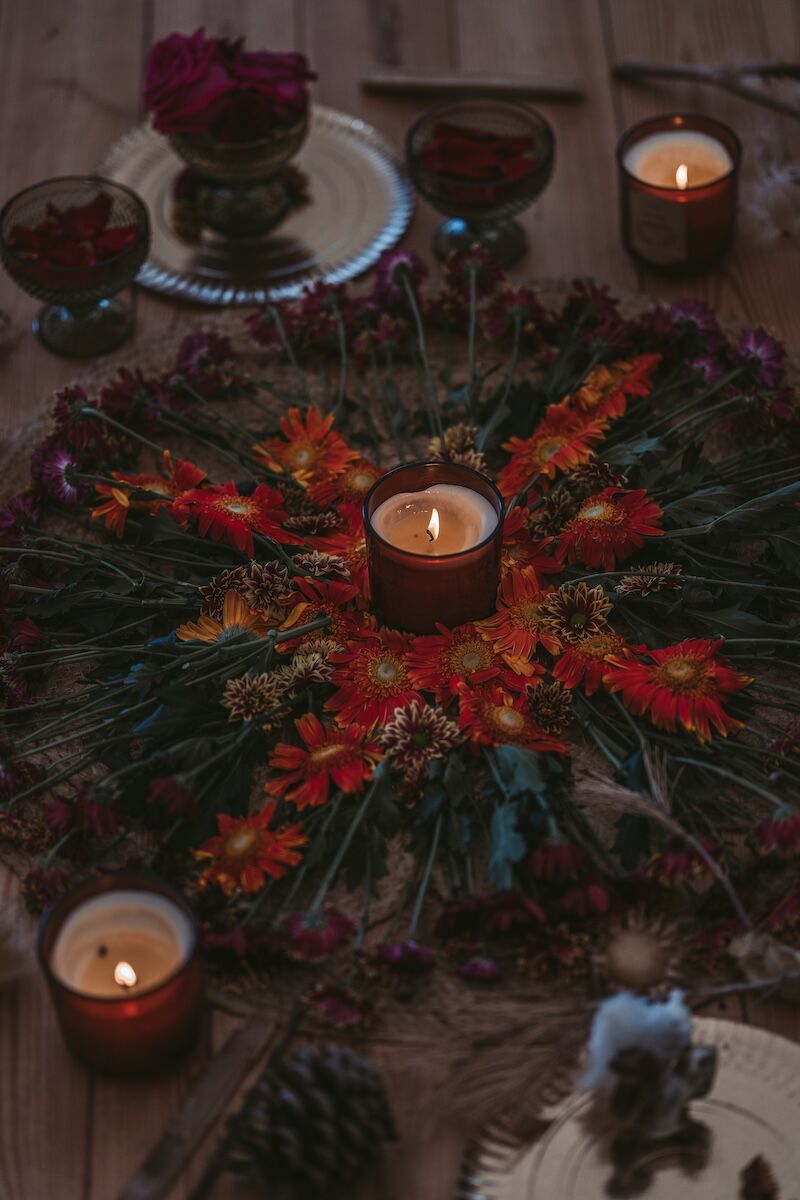 Image of a beautiful floral altar with candles from a men's retreat.