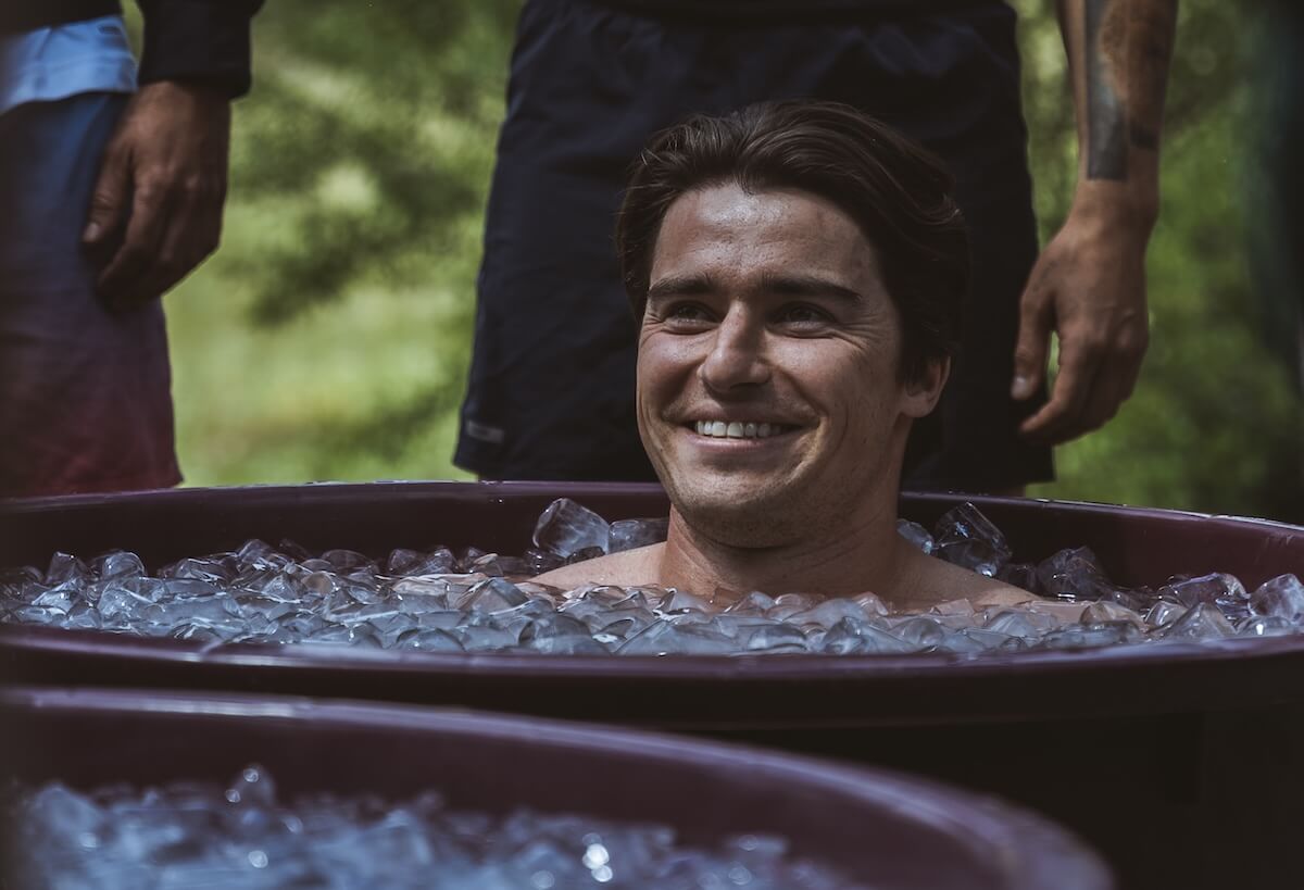 A man smiles up from the ice bath at The Return of Men retreat, BioVilla, Portugal, May 2026.