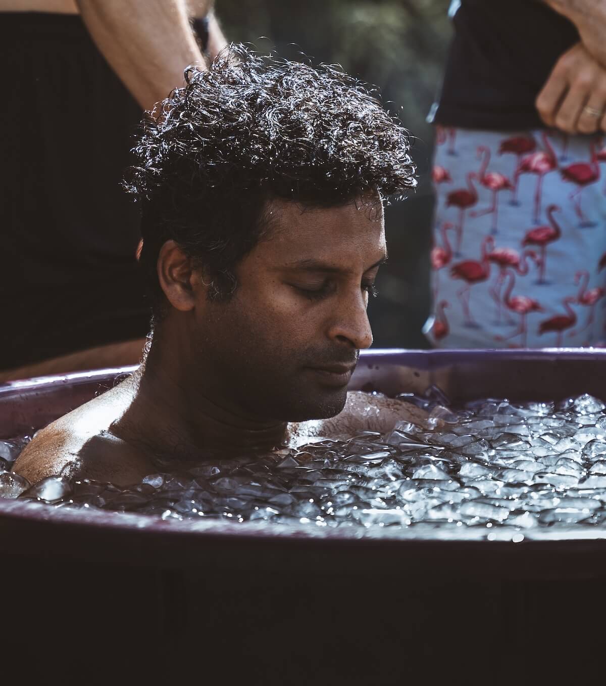 A man sinks into the cold with eyes closed as the others hold the space at The Return of Men retreat, 2026.