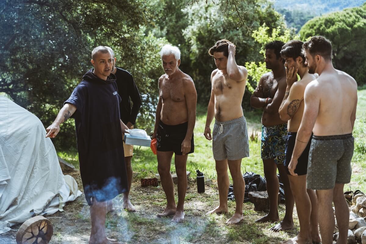 The men are briefed beside the covered sweat lodge at The Return of Men retreat, BioVilla, May 2026.