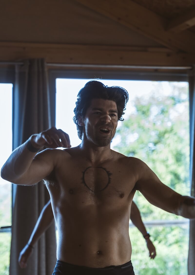 A man moves freely in ecstatic dance in the hall at The Return of Men retreat, Portugal, May 2026.